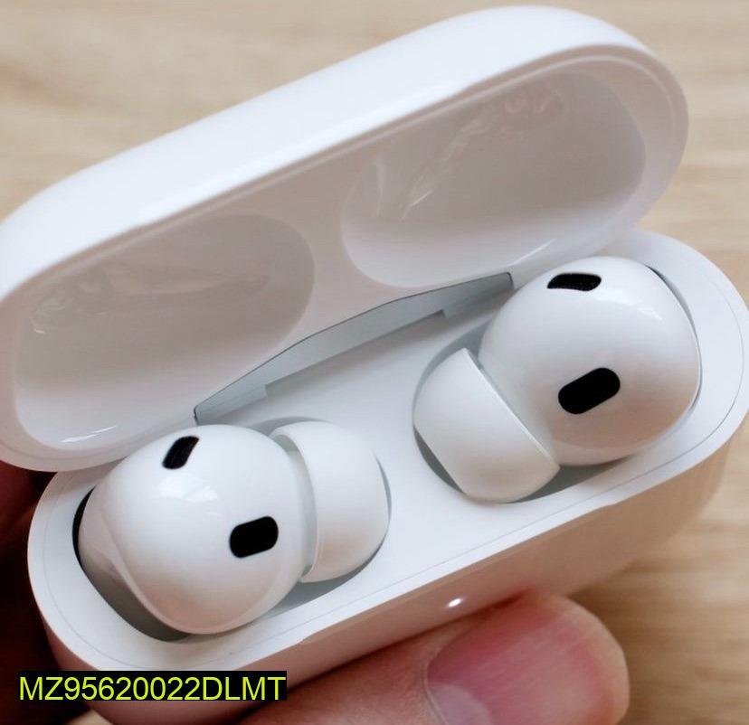White wireless earbuds in a transparent charging case on a light wooden surface.