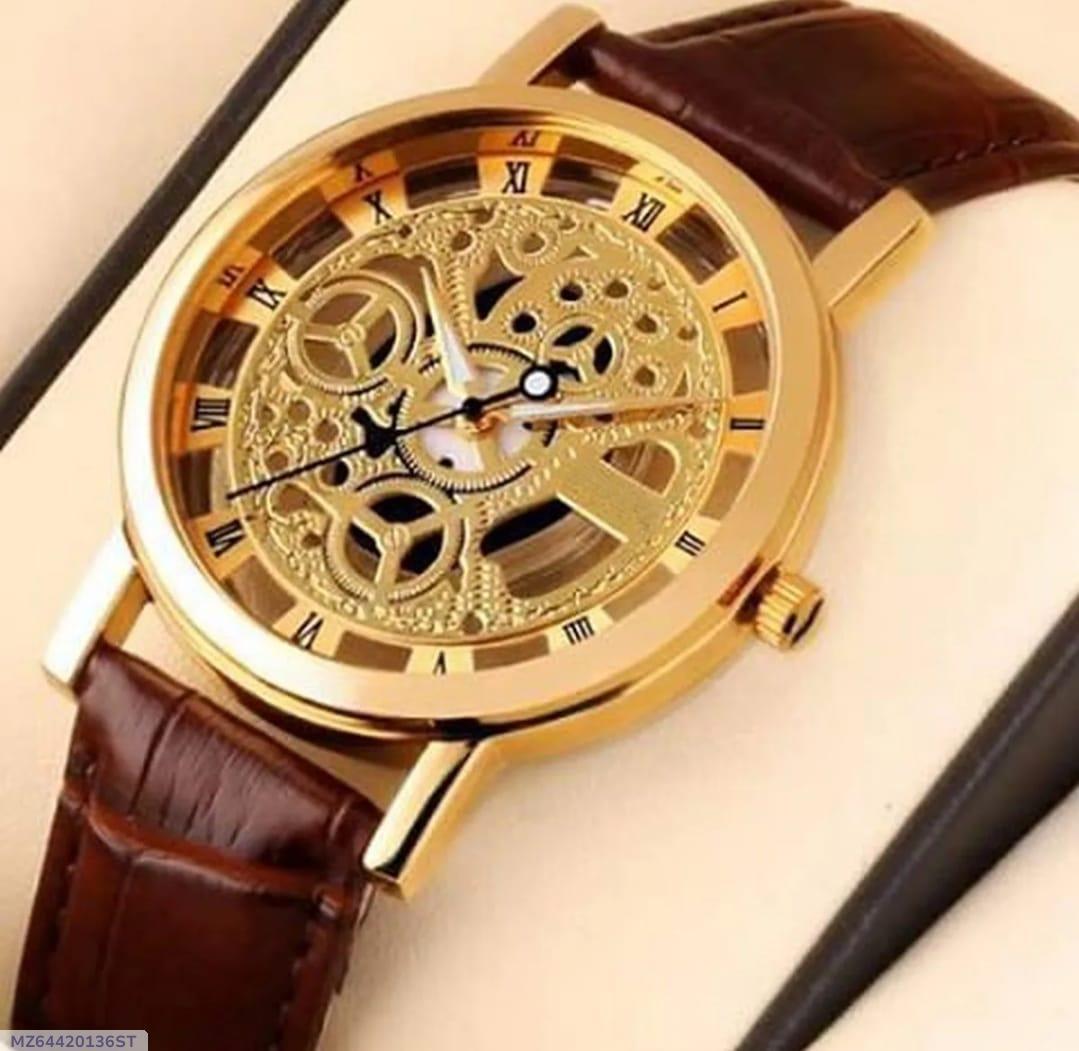 Gold wristwatch with brown leather strap on a beige background