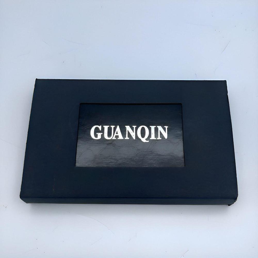 Black rectangular box with 'GUANQIN' branding on a white background