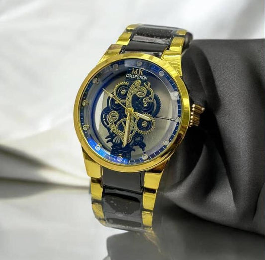 Gold and black watch with intricate design on a white background