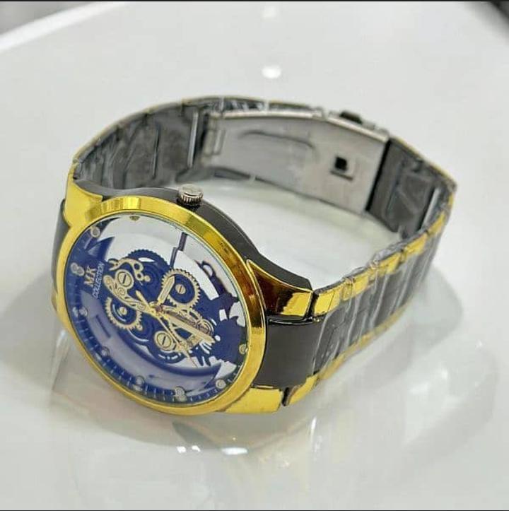Watch with gold and black strap on a white background
