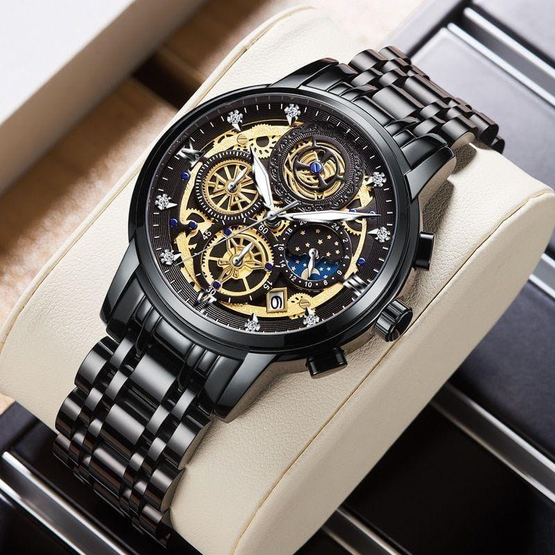 Luxury watch with black and gold design on a beige cushion