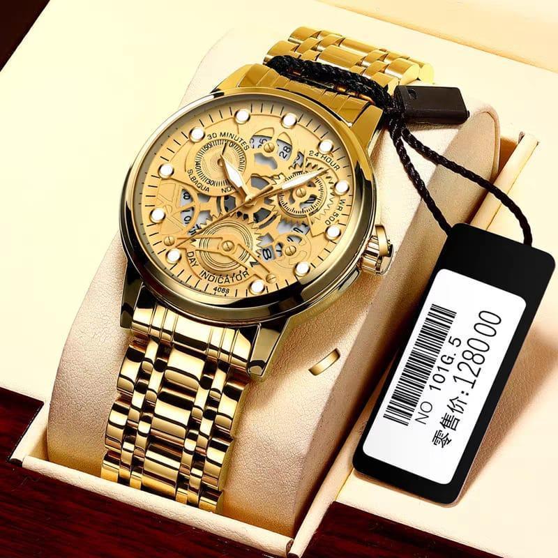 Gold wristwatch with intricate design in a box, accompanied by a price tag.
