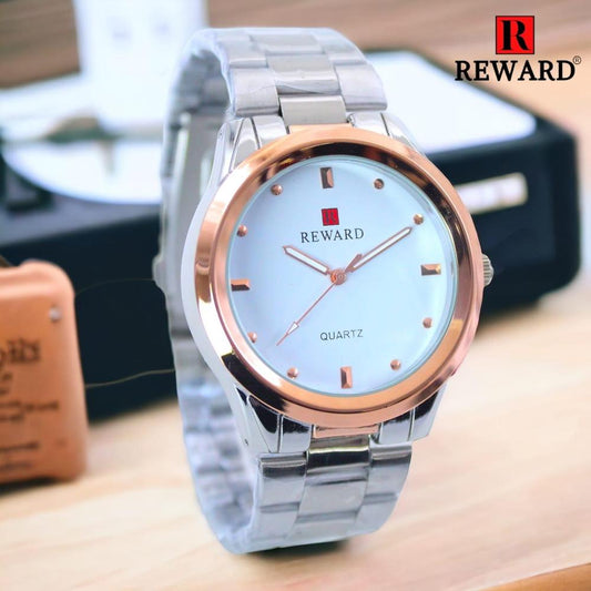 Silver and rose gold watch with 'Reward' branding on a blurred background