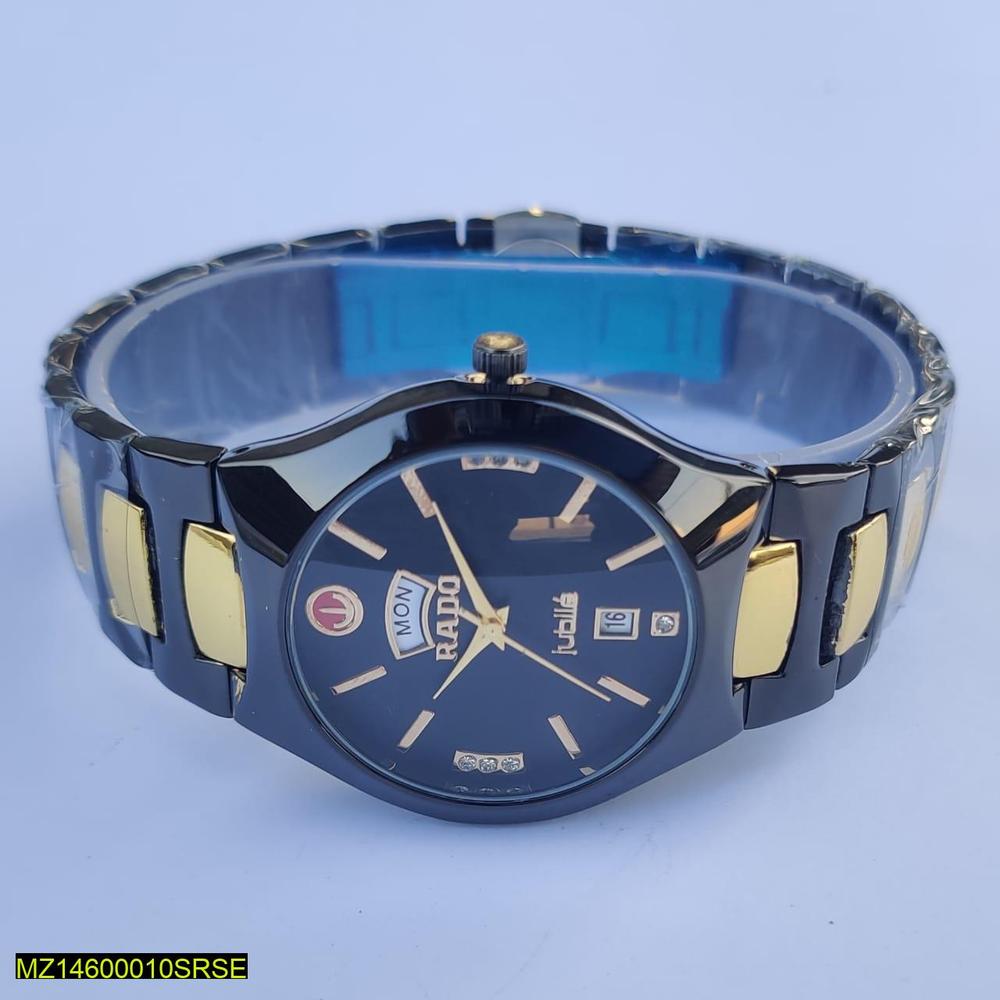 Wristwatch with blue and gold band on a light blue background