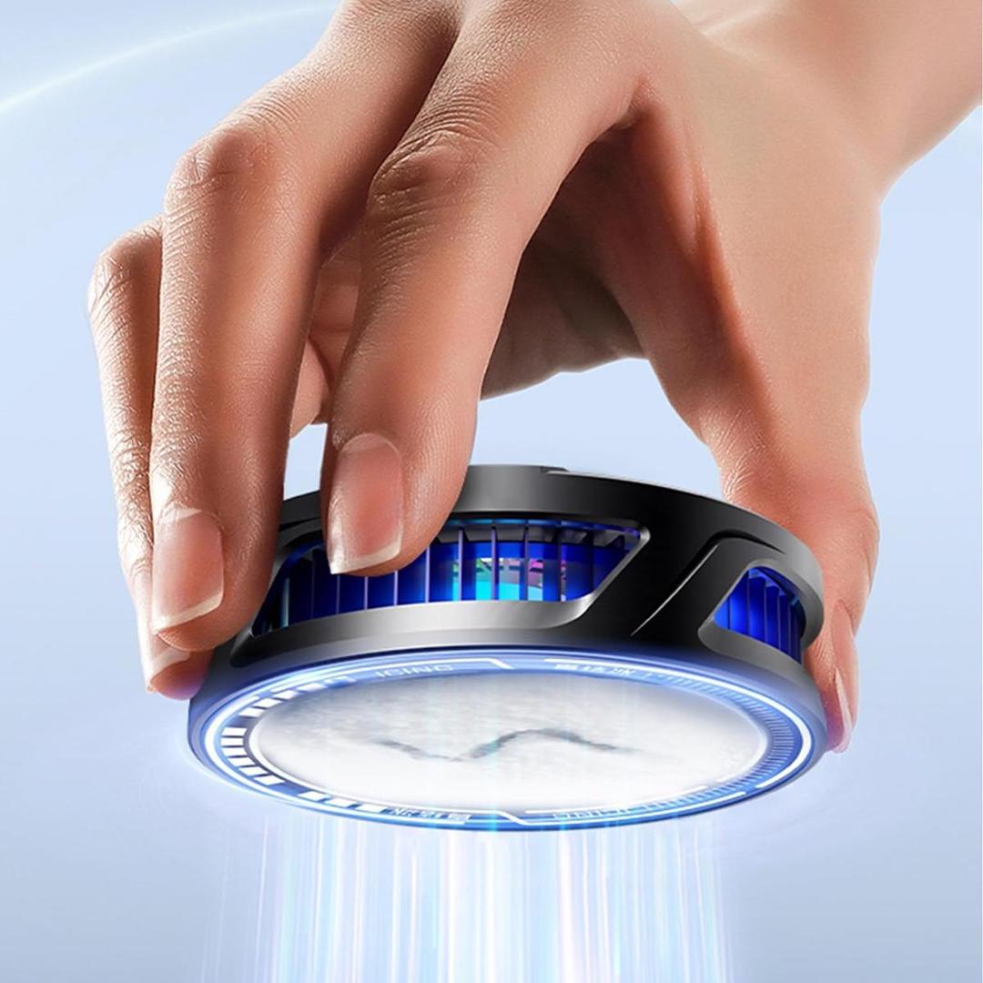 Hand holding a small circular device with blue lights on a light blue background