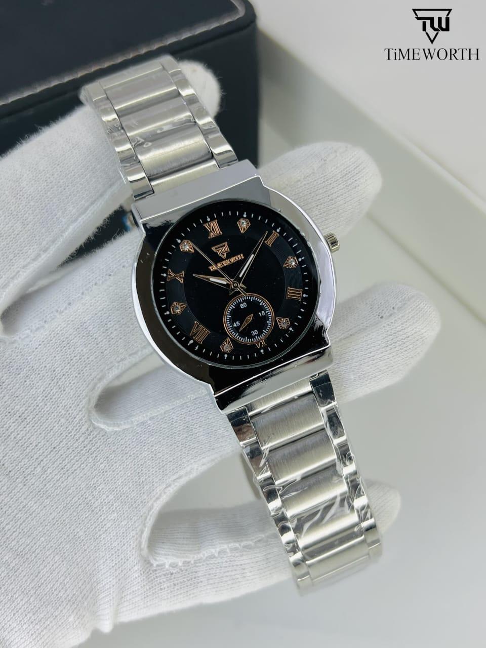 Silver watch with black dial on a white glove, brand 'TimeWorth' visible