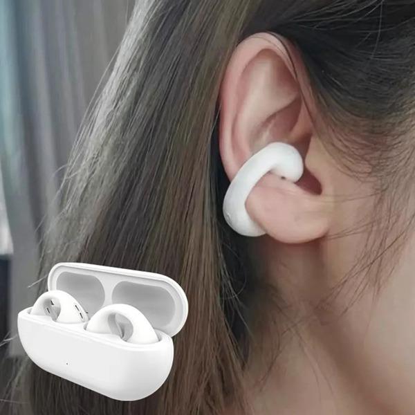 White wireless earbuds in use with a charging case on a blurred background