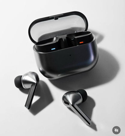 Wireless earbuds with charging case on a light gray background 